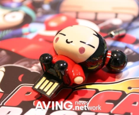 A 'PUCCA' figure USB memory used as a cell phone holder