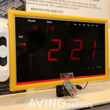A digital wall clock with built-in MP3 player and FM radio