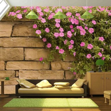 a Spread of Purple Flowers on a Rock Wall