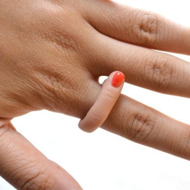 Finger Ring with Red Nail Polish